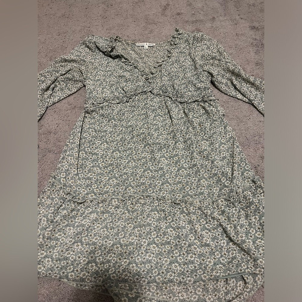 Short green dress with white flowers.